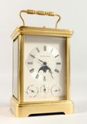 A SUPERB BRASS GRAND SONNERIE CARRIAGE CLOCK by MATTHEW NORMAN, SWISS MADE NO. 1781, the silvered