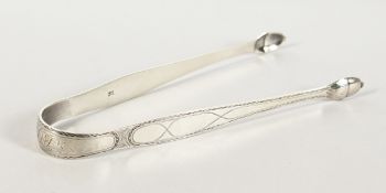 A PAIR OF GEORGIAN BRIGHT CUT SILVER SUGAR TONGS. Maker I. S.