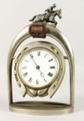A GOOD METAL EQUESTRIAN CLOCK, as a horseshoe hung between stirrups. 10ins high.