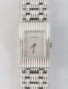 A GOOD BOUCHERON WRISTWATCH in a white leather pouch, No. AK416582.