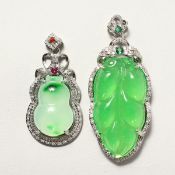 TWO JADE PENDANTS.