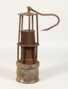 AN EARLY TILLEY LAMP.