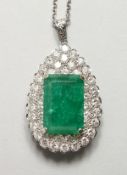 A SUPERB LARGE EMERALD AND DIAMOND TEARDROP PENDANT.