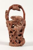 A JAPANESE CARVED WOOD BASKET carved with rats. 3.75ins high.
