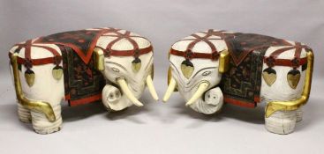 A PAIR OF LARGE 19TH CENTURY CHINESE HARDWOOD DECORATED ELEPHANT FORMED SEATS, The mirrored pair