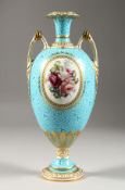 A CROWN DERBY TWO-HANDLED VASE, painted with reverse panels of flowers by R. HAGUE. 11.5ins high.