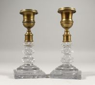 A GOOD PAIR OF CUT GLASS AND BRONZE CANDLESTICKS on square bases. 6ins high.