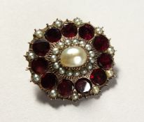 A VICTORIAN PEARL SET BROOCH.