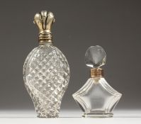 A CUT SILVER SCENT BOTTLE and A LOZENGE SHAPED SCENT BOTTLE (2).