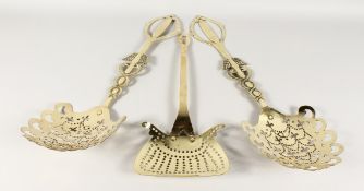 THREE BRASS MILK SKIMMERS.