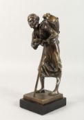 A BRONZE OF AN ARAB with a stick, on a marble base. Signed. 8.5ins high.