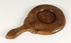 A LARGE TREEN CHEESE BOARD. 18ins long.