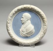 A SEVRES BLUE AND WHITE CIRCULAR PORTRAIT PLAQUE. 4.25ins diameter.