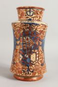 AN HISPANO LUSTRE DRUG JAR decorated with a crest and a pair of blue lions. 10ins high.