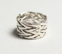 A SILVER KNOT RING.