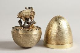 A STUART DEVLIN SILVER GILT EGG opening to reveal fishes London 1958, No. 183, in original box.