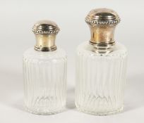 TWO SILVER TOP SCENT BOTTLES.