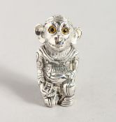 A SILVER PLATE MONKEY PIN CUSHION.