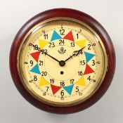 AN R.A.F. STYLE WALL CLOCK with multi-coloured dial. 9ins diameter.