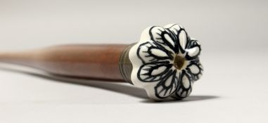 A WALKING CANE with PORCELAIN HANDLE. 2ft 8ins long.