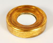 A MINIATURE GILTWOOD CONVEX MIRROR. 6ins diameter.