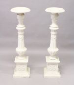 A GOOD PAIR OF VICTORIAN WHITE PAINTED CAST IRON STANDS, fluted columns on pedestal bases. 3ft