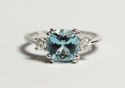 A SUPERB 18CT WHITE GOLD, AQUAMARINE AND DIAMOND THREE STONE RING. Aquamarine: 1.6cts. Diamonds: 0.