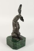 A BRONZE DONKEY on a marble base. 7ins long.