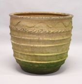A LARGE TERRACOTTA CIRCULAR JARDINIERE. 2ft 3ins diameter x 1ft 11ins high.