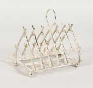A SILVER PLATE CROSS RIFLE TOAST RACK.