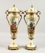 A VERY GOOD PAIR OF FRENCH PORCELAIN TWO-HANDLED VASES AND COVERS, cream ground painted with