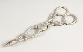 A PAIR OF CAST LEAF DESIGN SUGAR NIPS.