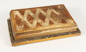 A LARGE GILDED WOOD STAND. 14ins long.