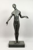 A TALL BRONZE FIGURE OF A STANDING MALE NUDE, in contemplative pose, on a rectangular base. 36ins
