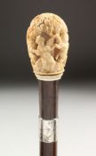 A 19TH CENTURY EUROPEAN CARVED AND PIERCED IVORY HANDLE CANE, carved with putti. 35