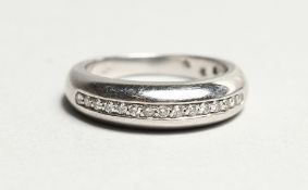 AN 18CT WHITE GOLD HALF ETERNITY RING.