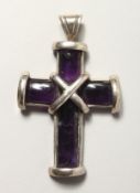 A SILVER AND AMETHYST CROSS.