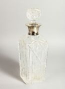 A CUT GLASS DECANTER AND STOPPER with silver band. London 1936.