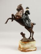 A. MAXIMILIEN LOUIS FIOT (1886-1953) CIRCA. 1925 A GOOD PAINTED BRONZE AND IVORY EQUESTRIAN GROUP of