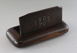 AN OVERSIZED FOLK ART TABLE SNUFF BOX with studded brass top. 1905 KG. 10ins long.