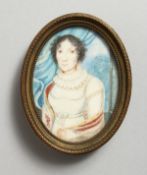 A SMALL 19TH CENTURY OVAL PORTRAIT MINIATURE, three-quarter length of a lady wearing a white
