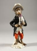 A GOOD 19TH CENTURY FURSTENBERG PORCELAIN MONKEY FIGURE playing a bagpipe. F mark in blue. 6ins