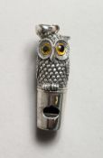 A SILVER OWL WHISTLE.