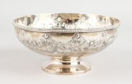 A VICTORIAN SILVER CIRCULAR FRUIT BOWL, 8ins diameter, the side repousse with a garland of