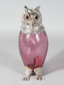 A GOOD PINK GLASS OWL CLARET JUG with plated head, collar and feet. 11ins high.