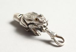A SILVER FROG WHISTLE.