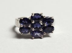 A SILVER AND SAPPHIRE RING.