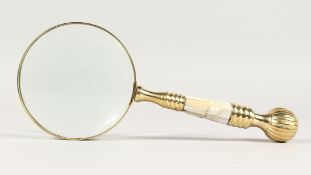 A MAGNIFYING GLASS with mother-of-pearl handle.