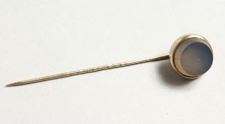 A RUSSIAN SILVER AND HARDSTONE PIN.