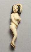 A BONE RECLINING NUDE. 3.5ins long.